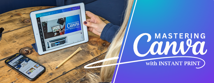 Person on Ipad looking at Mastering Canva with Instant Print