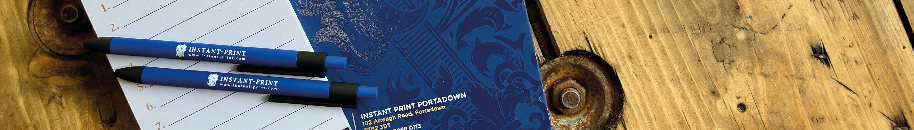 Instant Print 2024 Diary with a notepad and pens on top