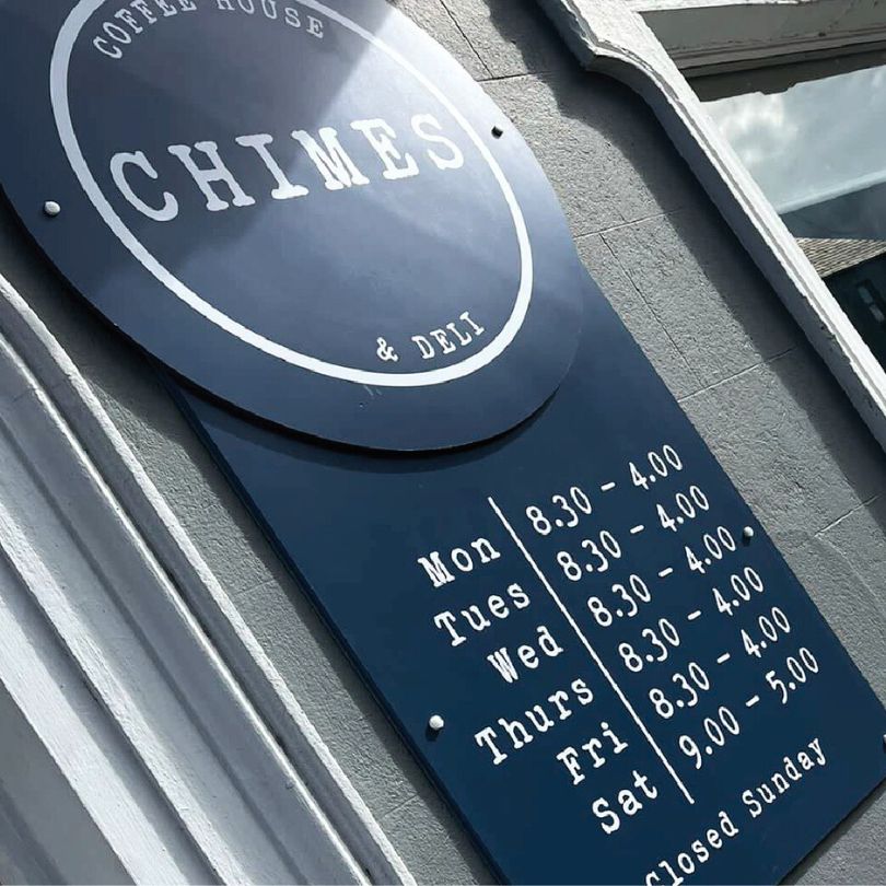 Shop Signage Chimes, with opening hours.