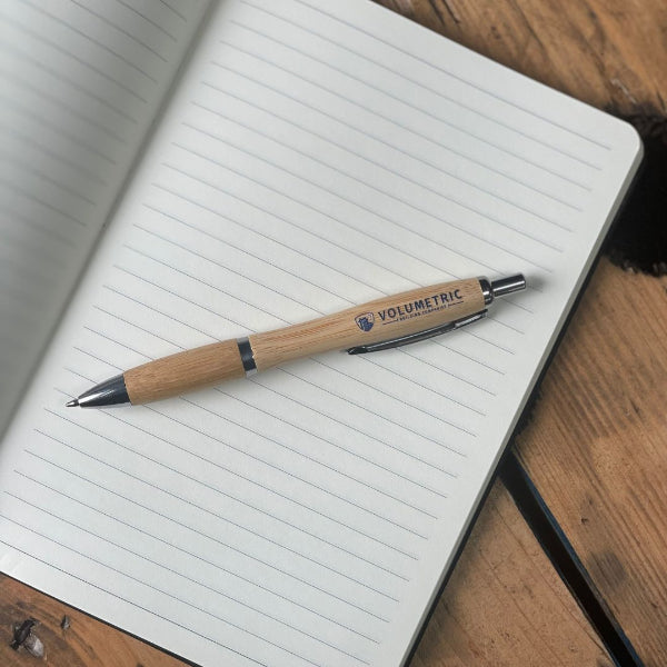 Matching Bamboo pen for the Cork Notebook with a UV printed logo, with a black elastic band and a pen holder