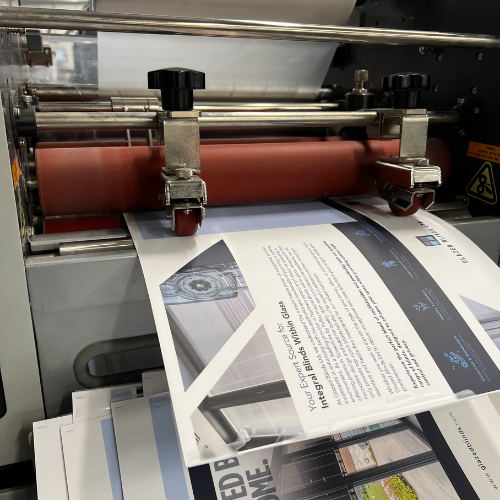 Printing press with a sheet of paper being printed