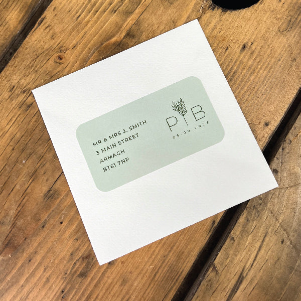 Light Green Wedding Address Labels, with the address and the initials, Stuck on a Textured Envelop.