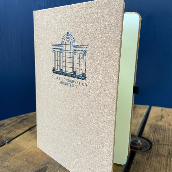 Cork notebook on wooden table