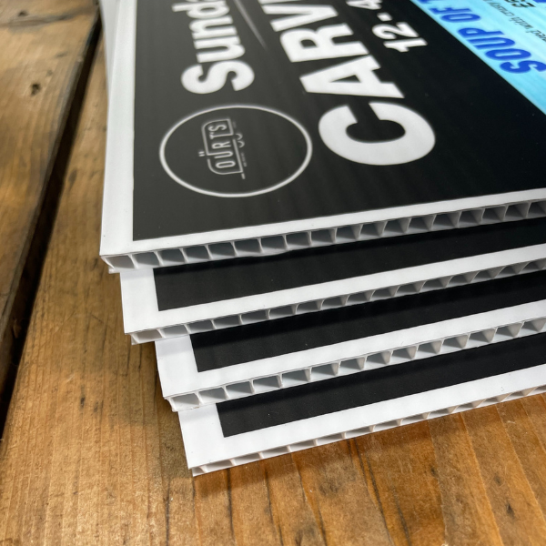 OUR T's blue correx board on wooden table