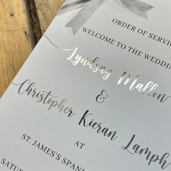 Close-up of Silver Foiling Wedding Order of Service