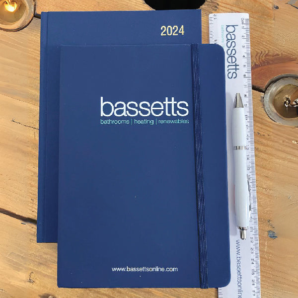 Blue Notebook with a blue ribbon, printed with a UV printed logo for Bassetts. Picture with a matching diary and printed Ruler.