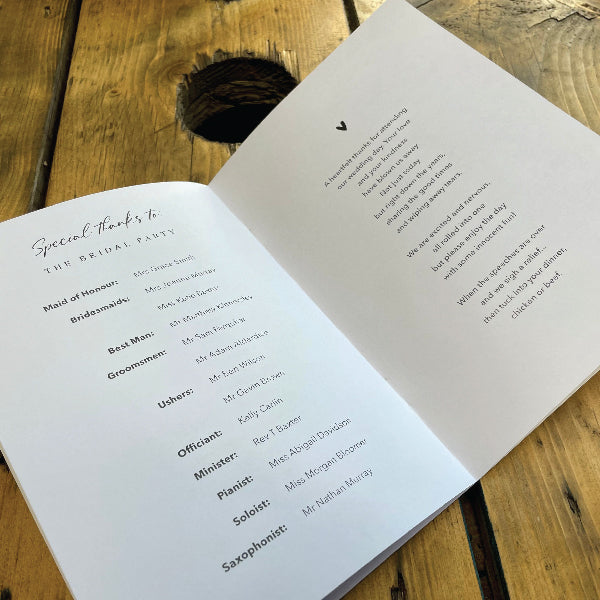 Stapled Order of Service Booklet, folded open so you can see the details on the inside
