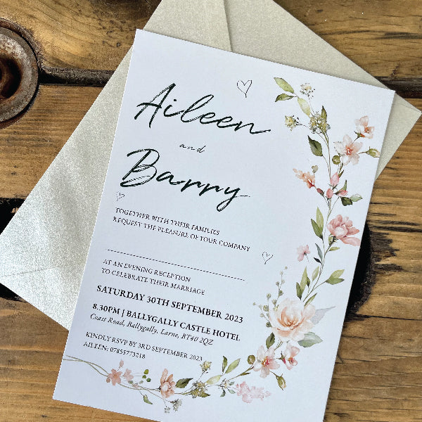 Floral Wedding Invitations printed on Textured card, displayed on a Ivory Pearlescent Envelop