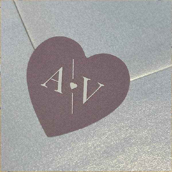Pink Heart Shaped Wedding Sticker with the initials AV, on the back of a pearlescent envelop