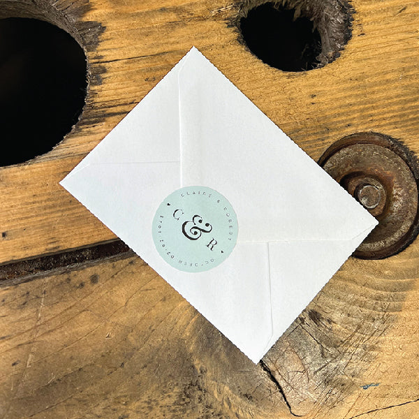 Light Blue Wedding Circle Stickers, on the back of an envelop.