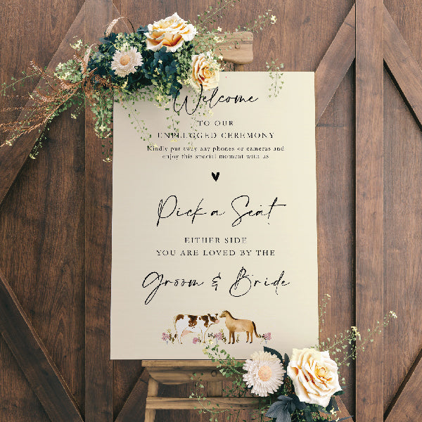 A1 Wedding Welcome Sign, positioned on an easel with the text "Pick a Seat either side, you are love by the groom & bride"