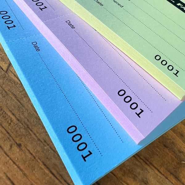 Colorful tickets on a wooden surface