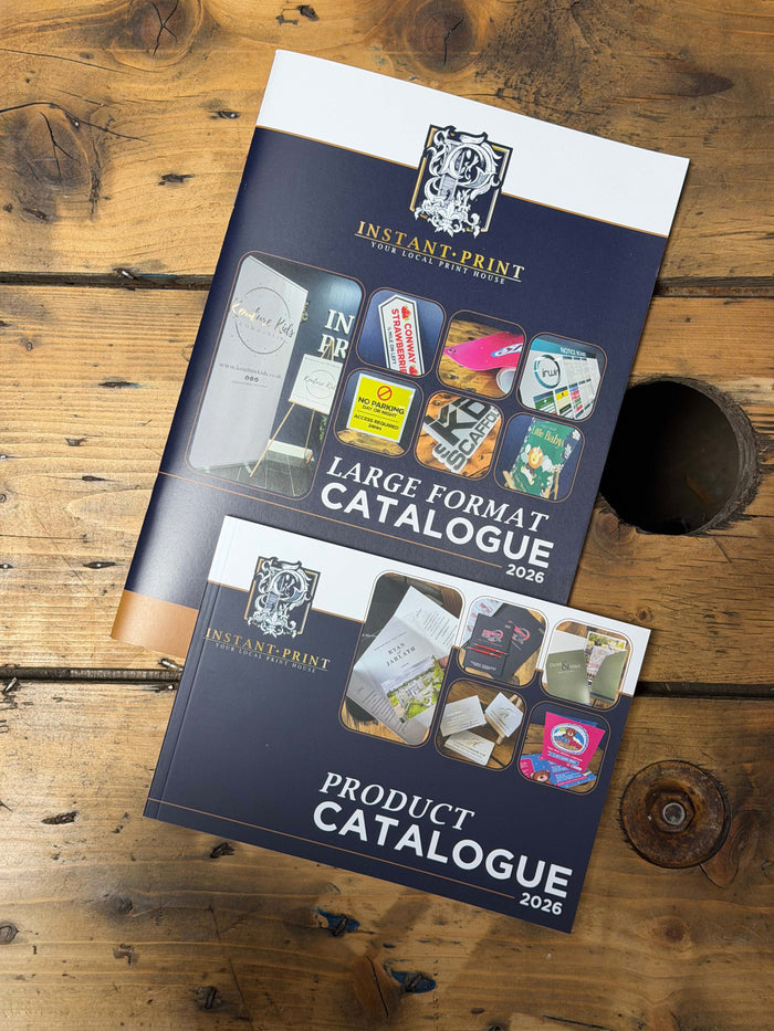 Instant Print Catalogue on a wooden table.