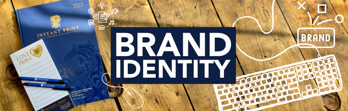 Brand Identity with artwork on image of diary on a wooden table