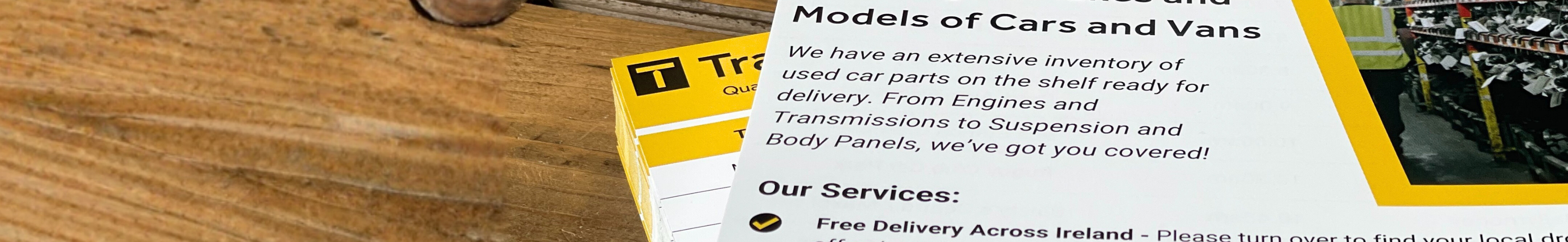 Yellow and white stack of leaflets on wooden table