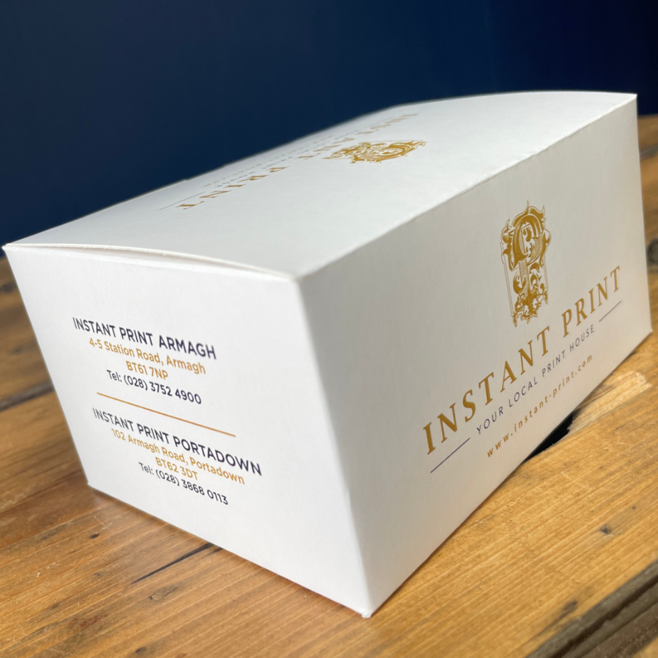 Product Packaging for Business Cards with Instant Print's Logo and contact details