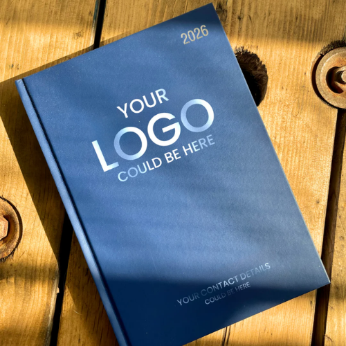 Blue diary with customizable text on a wooden surface