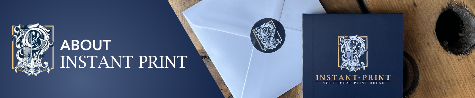 Instant Print branding with a blue envelope and logo on a wooden surface.