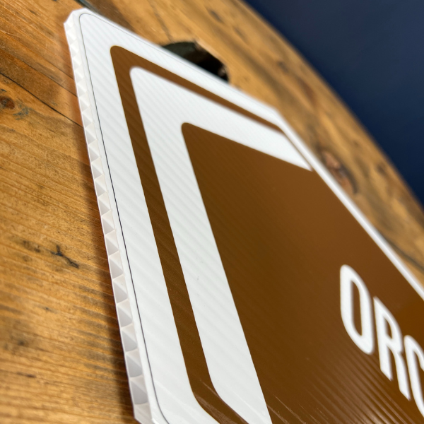 Custom shape brown direction sign