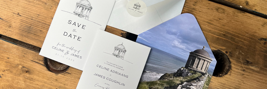 Wedding save the date cards, invitation & envelope with sticker with a scenic design envelope liner on a wooden surface