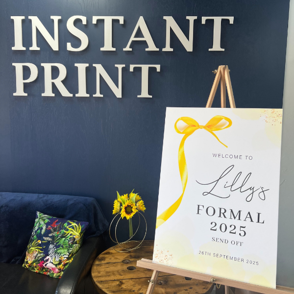 yellow and white foamex board against blue background